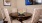 a table with chairs and a bowl of food on it