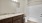 a bathroom with marble counter tops