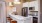 a kitchen with a bar stool and a counter top
