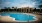 a pool with a building in the background