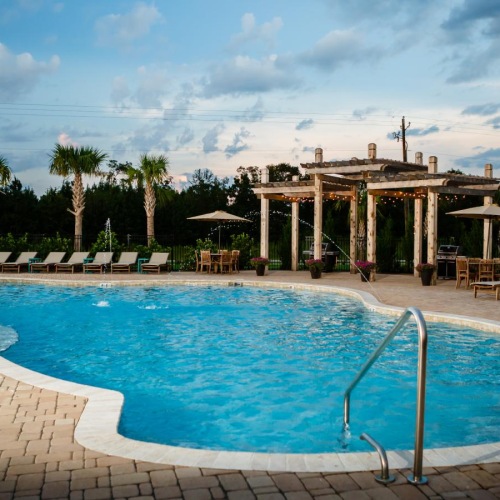 a pool with a building in the background